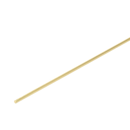 Long thin brass rod on a white background