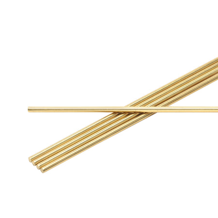Five brass rods stacked on a white background