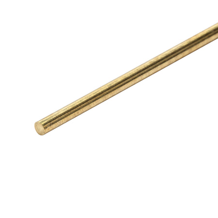 A single brass rod on a white background