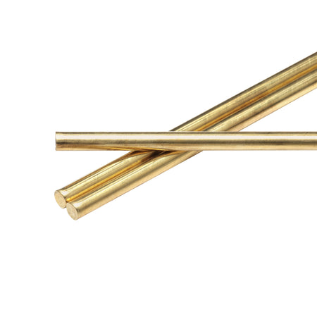 Three brass rods on a white background