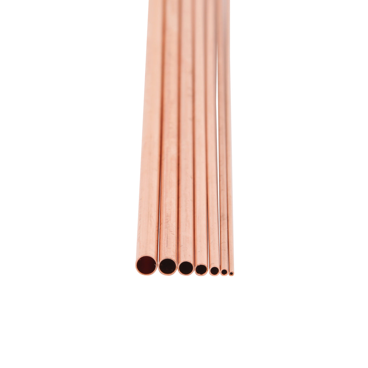 Set of copper tubes of various sizes on a white background